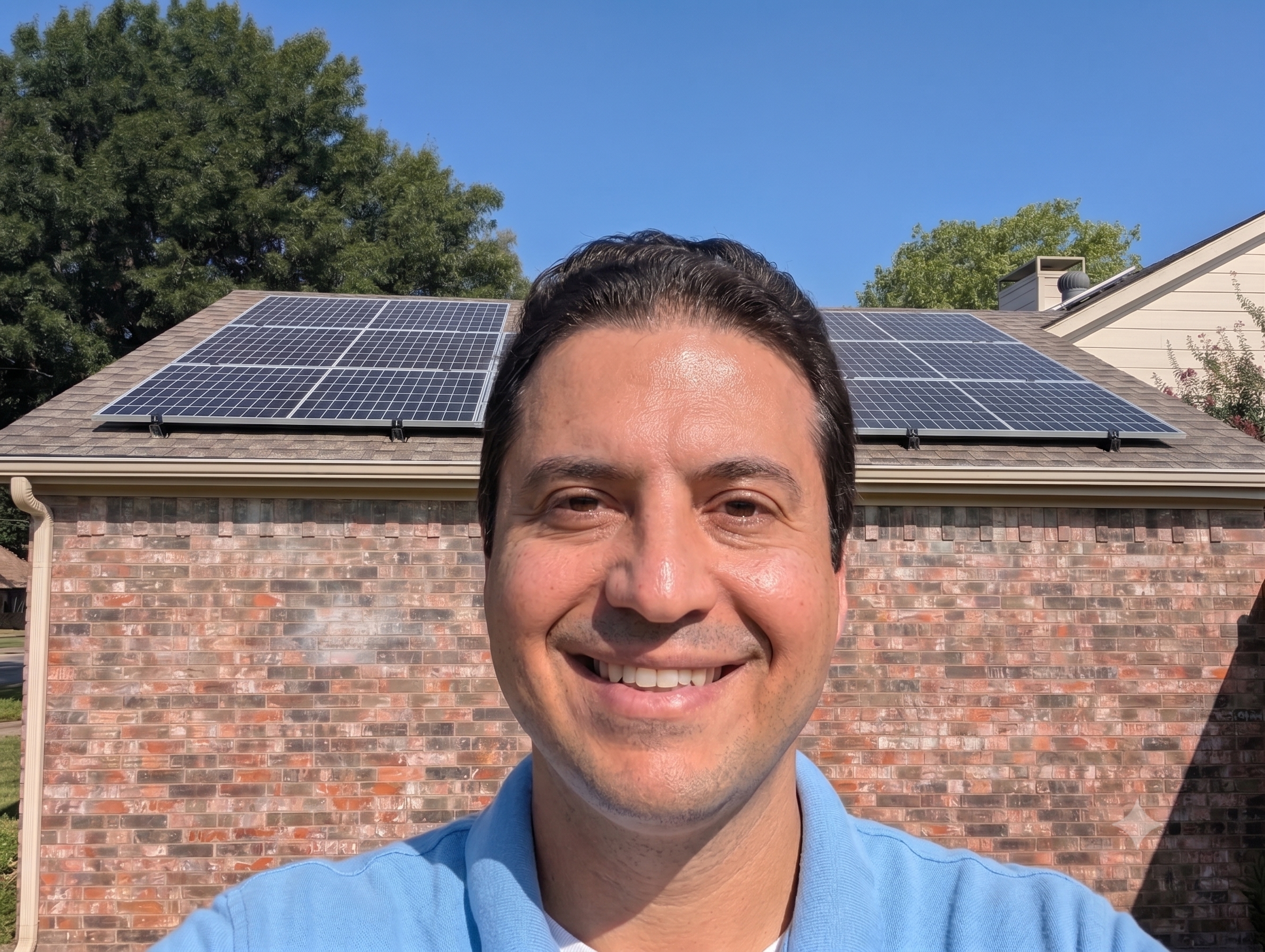 Michael Cogliandro at his home in North Texas, beneath his own rooftop solar array